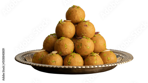 Traditional Indian sweet besan ladoo served on a decorative plate isolated on white background