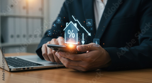 Falling Mortgage Rates: A man in his 30s uses his smartphone to track decreasing interest rates in the housing market.