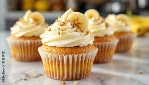 vanilla cupcake with cream and slice of banana
