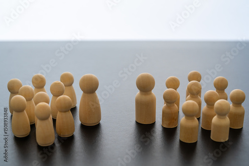 Canvas Print Conceptual representation, with wooden pawns, of gender differentiation and struggle