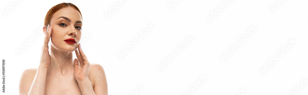 Fototapeta premium Beautiful young woman showcasing radiant skin with confident expression in minimal setting
