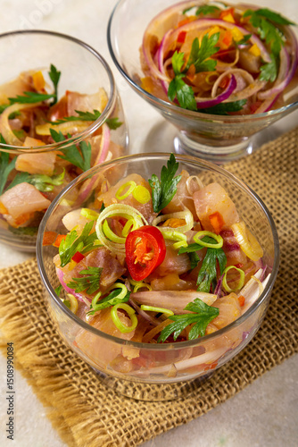 CHILEAN SALMON SEVICHE. Fresh raw salmon marinaded with purple onion, coriander in lemon juice.
