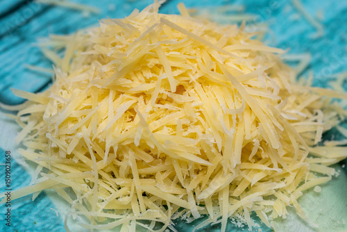 Cuadro en lienzo Grated Parmesan cheese on stone