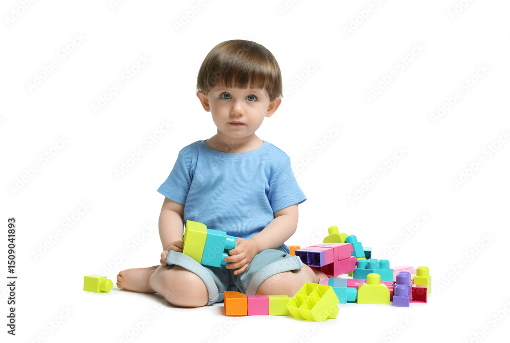 Cute little boy playing with building bricks on white background Cute little boy playing with building bricks on white background