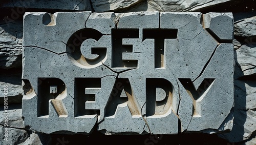 Stone Block with 'Get Ready' Carved in Cracked Surface – Dark Warrior-Themed Text on Rugged Grey Rock Texture