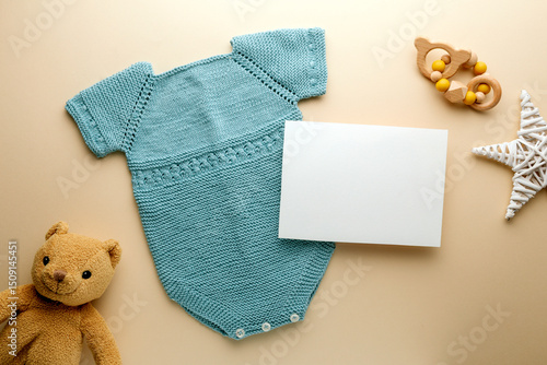 Newborn baby clothes mockup featuring hand-knitted, soft, and cozy babywear flatlay with a minimalist infant outfit