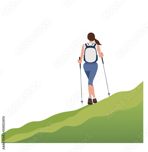 Woman hiking up a hill with backpack and trekking poles