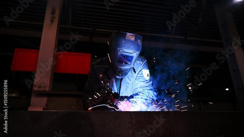 Welding Process in Industrial Setting is characterized by intense Sparks and Smoke