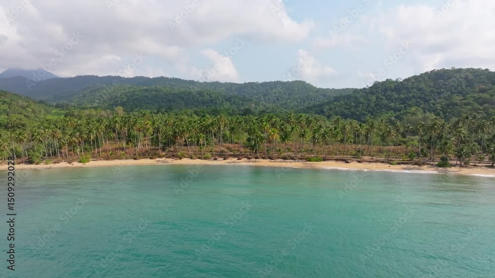 Empty golden shore meets bright water in quiet Koh Chang, Thailand. Aerial drone video Empty golden shore meets bright water in quiet Koh Chang, Thailand. Aerial drone video