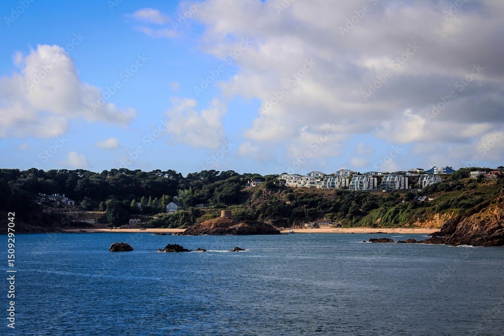 Obraz premium Coast of Jersey Island seen from water, Channel Islands