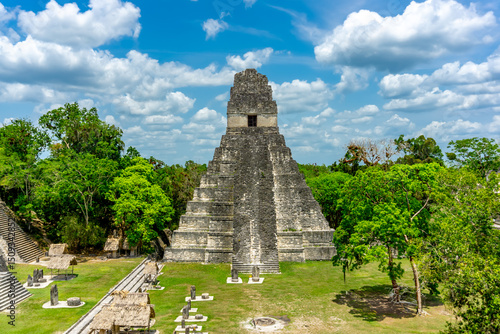 The majestic Pyramid of Tikal rises from the Guatemalan jungle, showcasing ancient Mayan architecture, rich history, and breathtaking views in a UNESCO World Heritage Site.