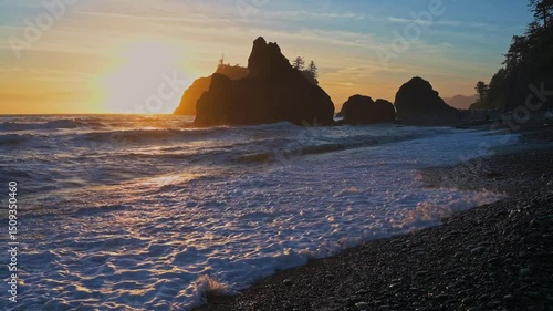 Strong Waves of the Pacific Ocean crash against the shore at Ruby Beach during sunset in Olympic National Park, Washington, USA. 4K UHD video.