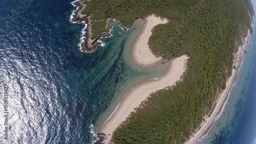 Turquoise water meets white sand and green vegetation in this stunning aerial view of wilsons promontory national park