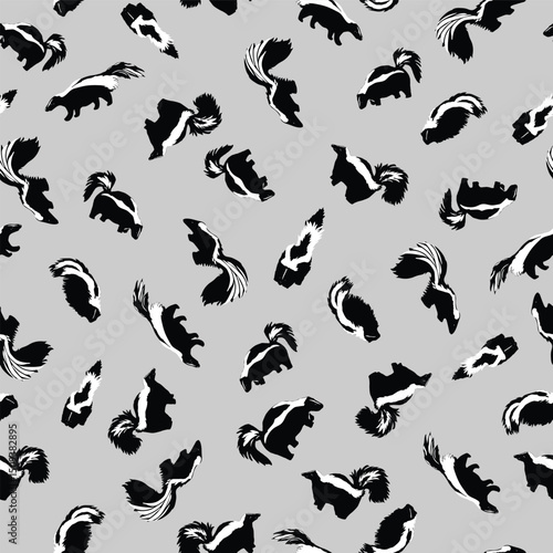 Cute Black and White Skunks Scattered Non Directionally on Gray creating a seamless pattern print