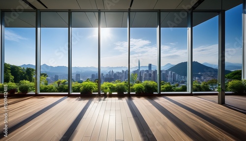 indoor garden with large windows showcasing mountains and cityscape under sunlight