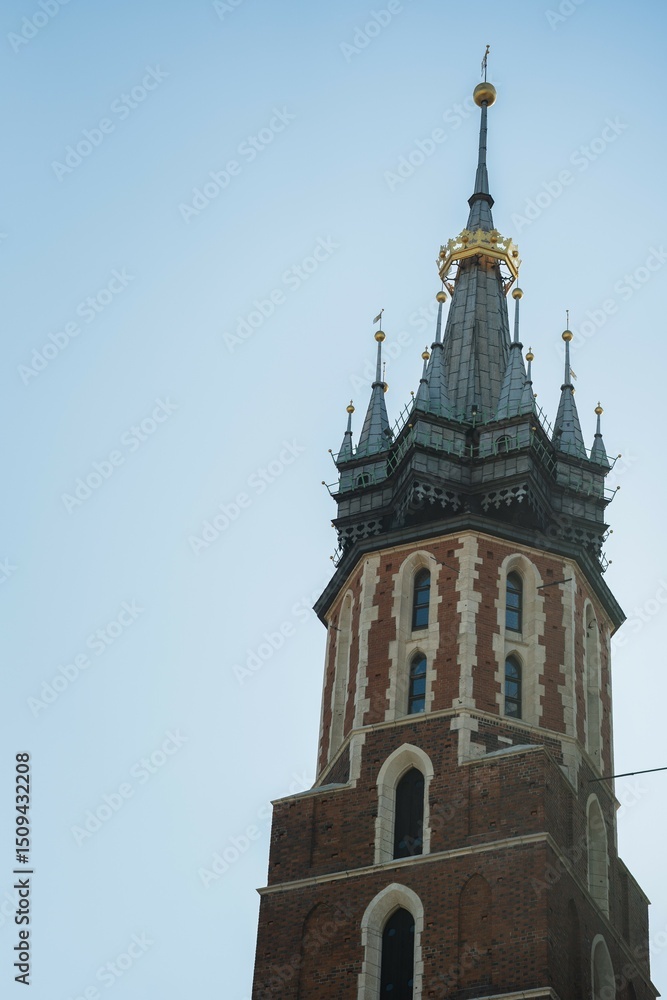 Historic church tower stands tall for architectural reference in Krakow, Poland. Useful for travel, architecture, or European landmark search queries. Historic church tower stands tall for architectural reference in Krakow, Poland. Useful for travel, architecture, or European landmark search queries.