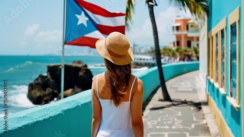 Vacation in Puerto Rico. Back view of tourist woman walking along promenade of San Juan city in Puerto Rico, Caribbean.	