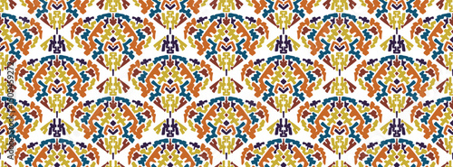 Artistic textured vector red, blue and orange hand drawn squiggle shapes seamless pattern with Aztec motif. Funky decorative African tribal ornament for textile design, wrapping paper, surface