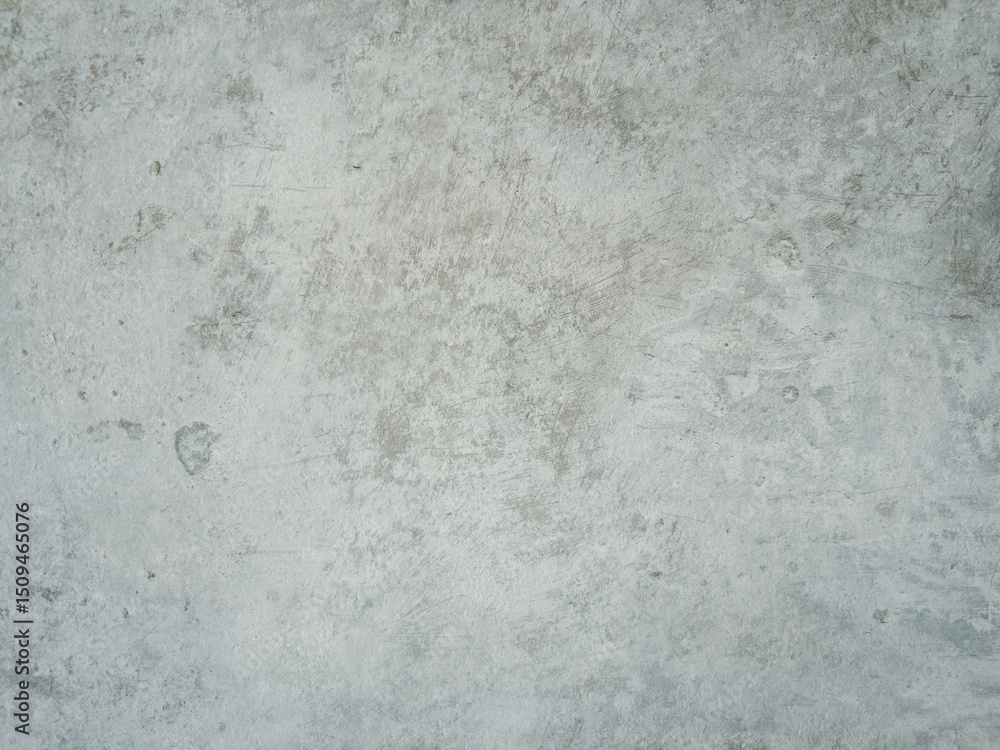 Fototapeta premium Detailed close-up of a light grey textured surface resembling aged concrete or stone with subtle variations and marks, perfect for backgrounds