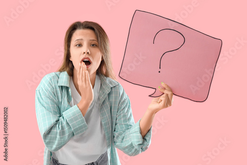 Shocked young woman holding...