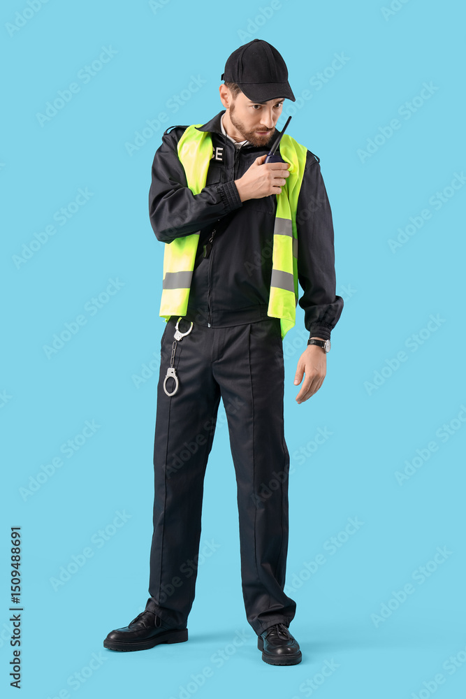 Male traffic police officer with radio transmitter on blue background Male traffic police officer with radio transmitter on blue background