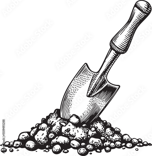 shovel rests in a pile of dark soil.