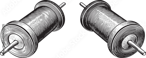 Two cylindrical spools of wire rest on a white surface.