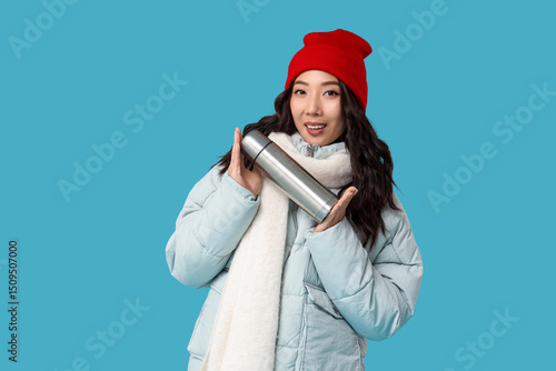 Young Asian woman in winter...