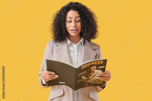 Young businesswoman reading...