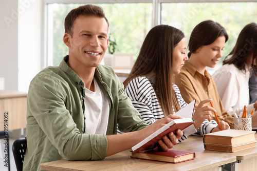 Male student with books and...