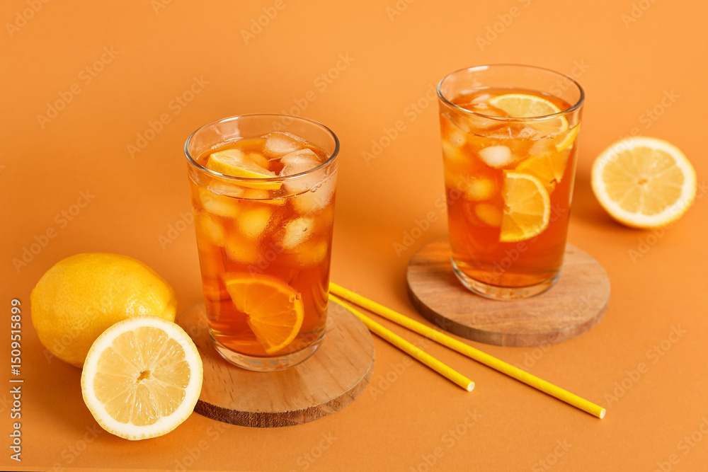 Glasses of fresh iced tea on orange background Glasses of fresh iced tea on orange background