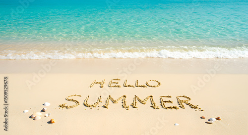 Beach scene with “Hello Summer” written in the sand and waves in the background.
