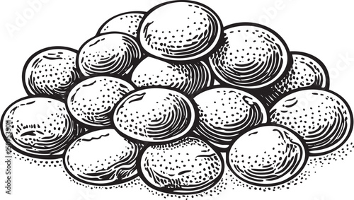 large group of round dark stones gathers together on a white surface.