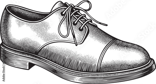 black leather shoe sits on a dark surface.