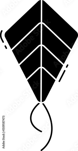 Black kite soars high against clear sky, its tail streamers dancing in the wind, capturing the essence of freedom and joy.