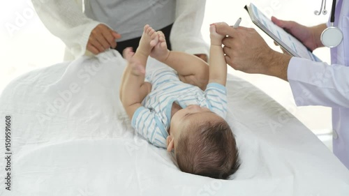 Asian loving mother comforts her three-month-old, as a male doctor administers essential childhood vaccinations, ensuring the baby's healthy future in a calm, professional setting.
