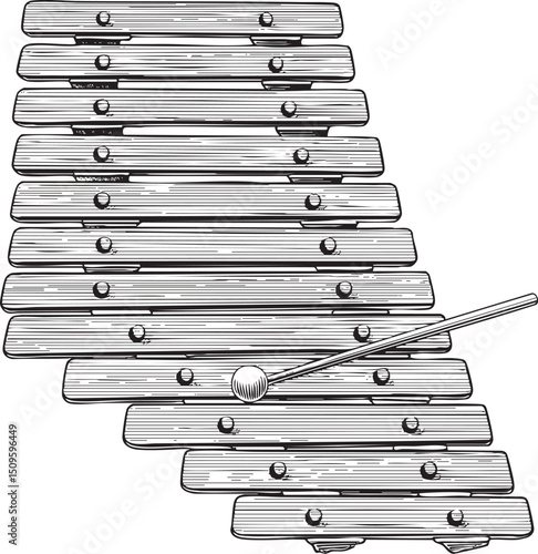 black and white xylophone rests on a wooden surface.