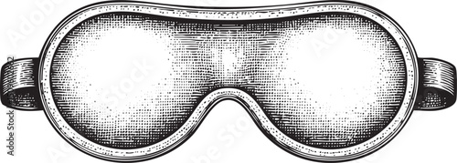 black and white sleep mask rests on a stark white background.