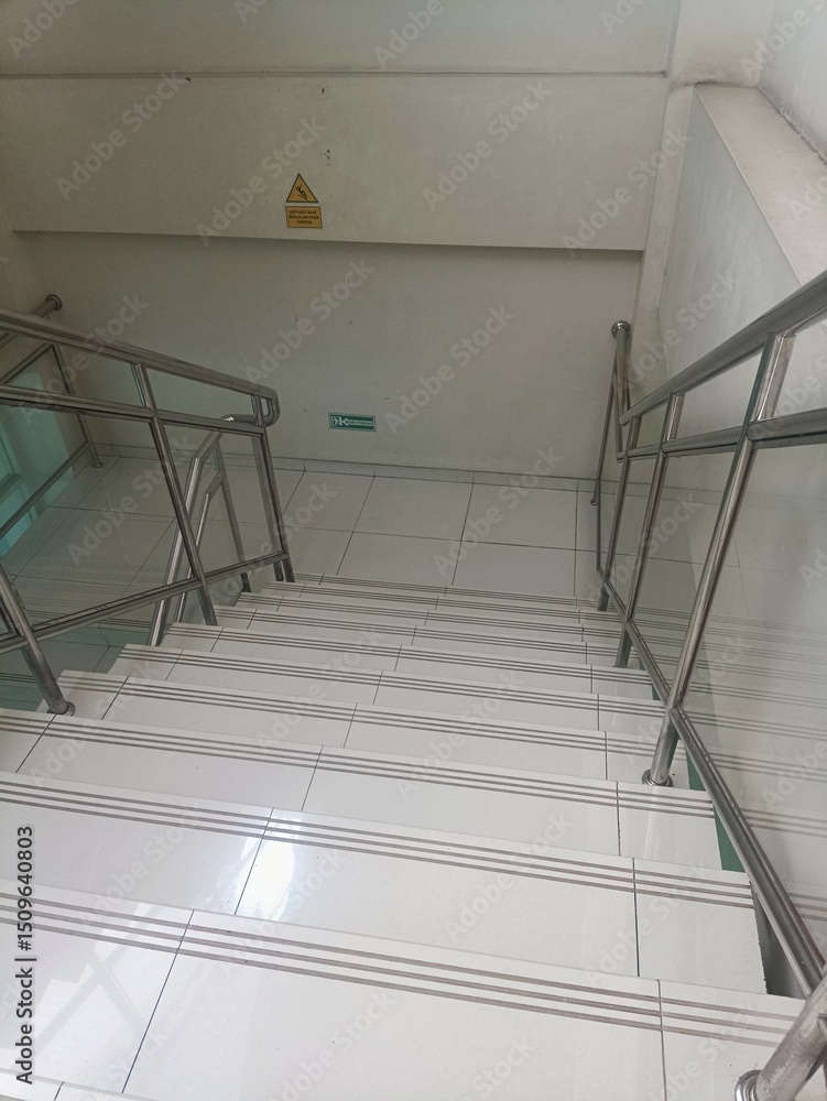 Fototapeta premium Modern Indoor Staircase with Stainless Steel Handrails