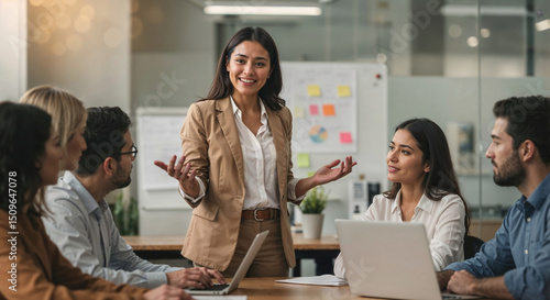Hispanic businesswoman guiding collaborative team through brainstorm meeting