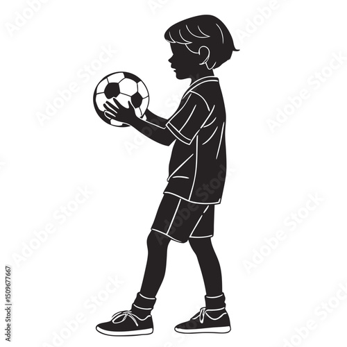 Silhouette of Young Boy Holding a Soccer Ball
