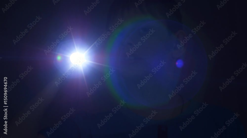 custom made wallpaper toronto digitalfocused caucasian boy 11 years old in the dark with a flashlight looking for shines a beam into the camera, scared child at night with a flashlight looking around in search