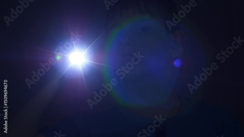 Wallpaper Mural focused caucasian boy 11 years old in the dark with a flashlight looking for shines a beam into the camera, scared child at night with a flashlight looking around in search Torontodigital.ca