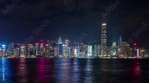 Wallpaper Mural Hong Kong 01.03.2025 Stunning nighttime view of Hong Kong's skyline featuring vibrant illuminated skyscrapers along the waterfront. The reflections on the water add depth, capturing the essence of urb Torontodigital.ca