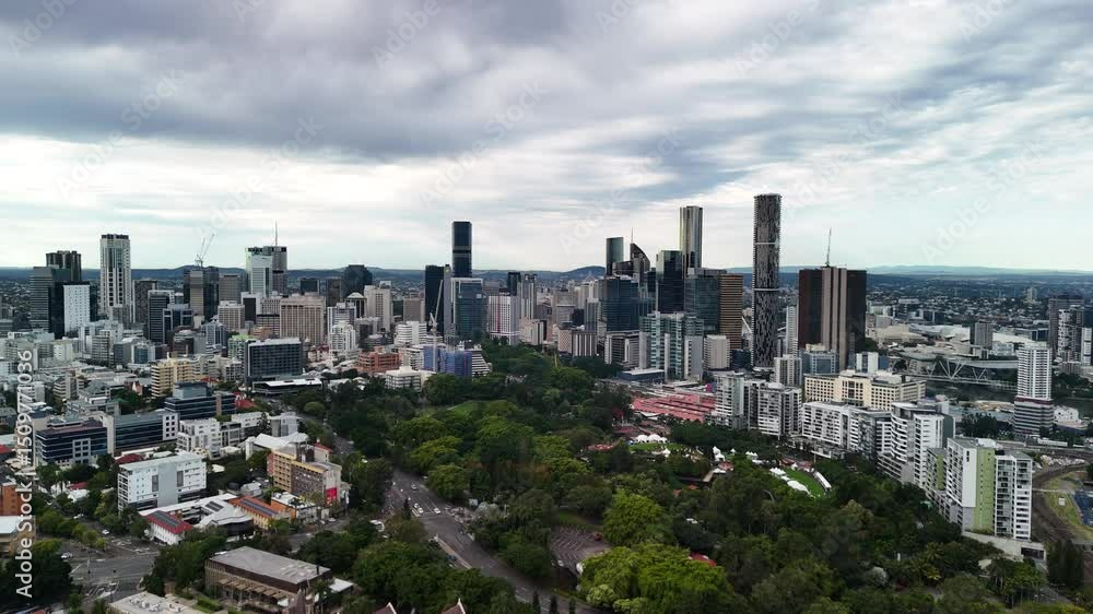 Aerial view of the towering urban skyline of Brisbane City metropolitan area and Roma Street Parkland. Aerial view of the towering urban skyline of Brisbane City metropolitan area and Roma Street Parkland.
