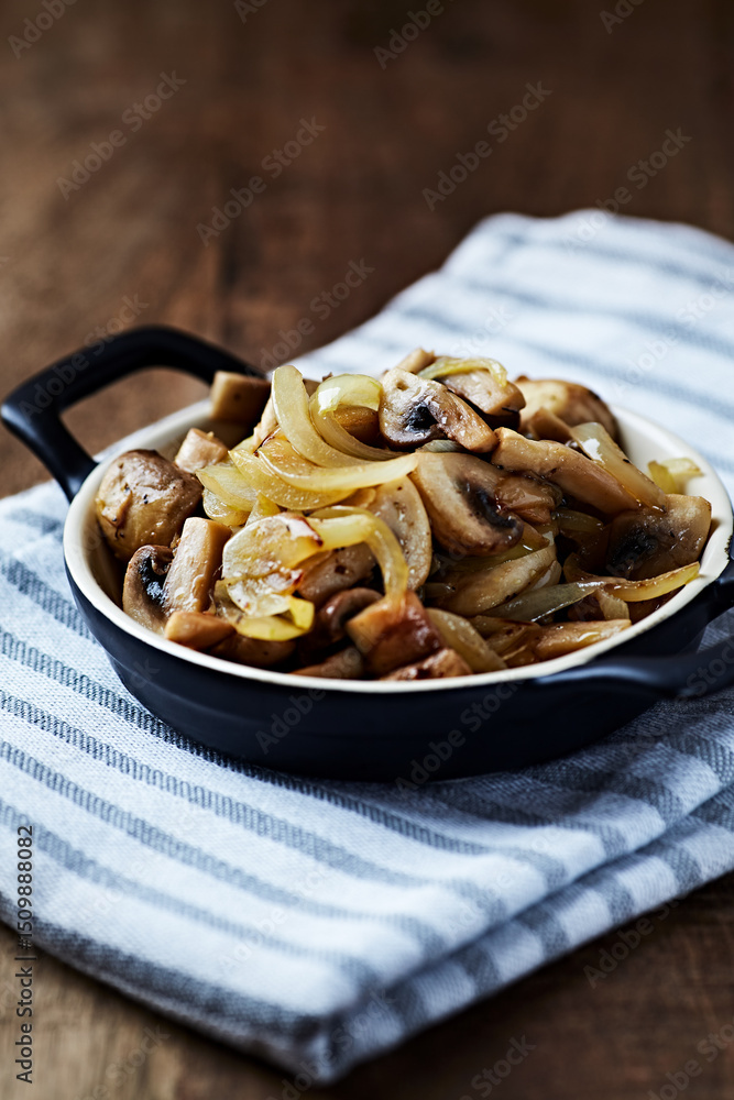 Fototapeta premium Onion with mushrooms. Rustic wooden background. 