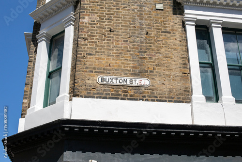 Buxton Street Sign on Brick Building, London