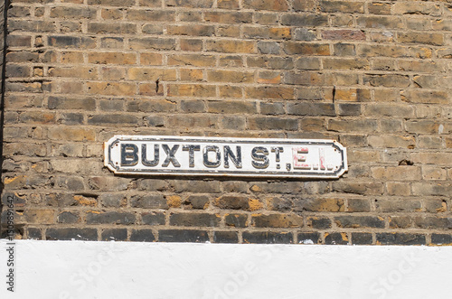 Buxton Street Sign on Brick Wall in London