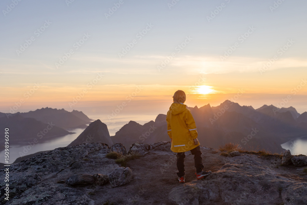 Fototapeta premium Children and adults, family with dog, hiking Grytetippen trail in Senja, Lofoten on a sunny hot summer day