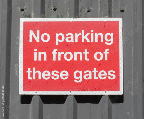 No Parking Sign on Metal Gate